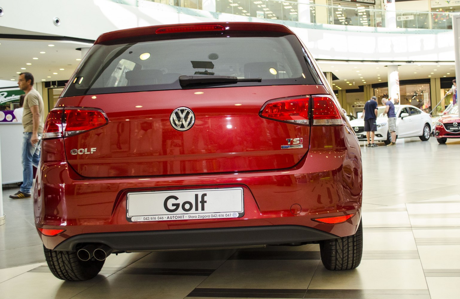 Rear view showing tail lights and dual exhaust pipes