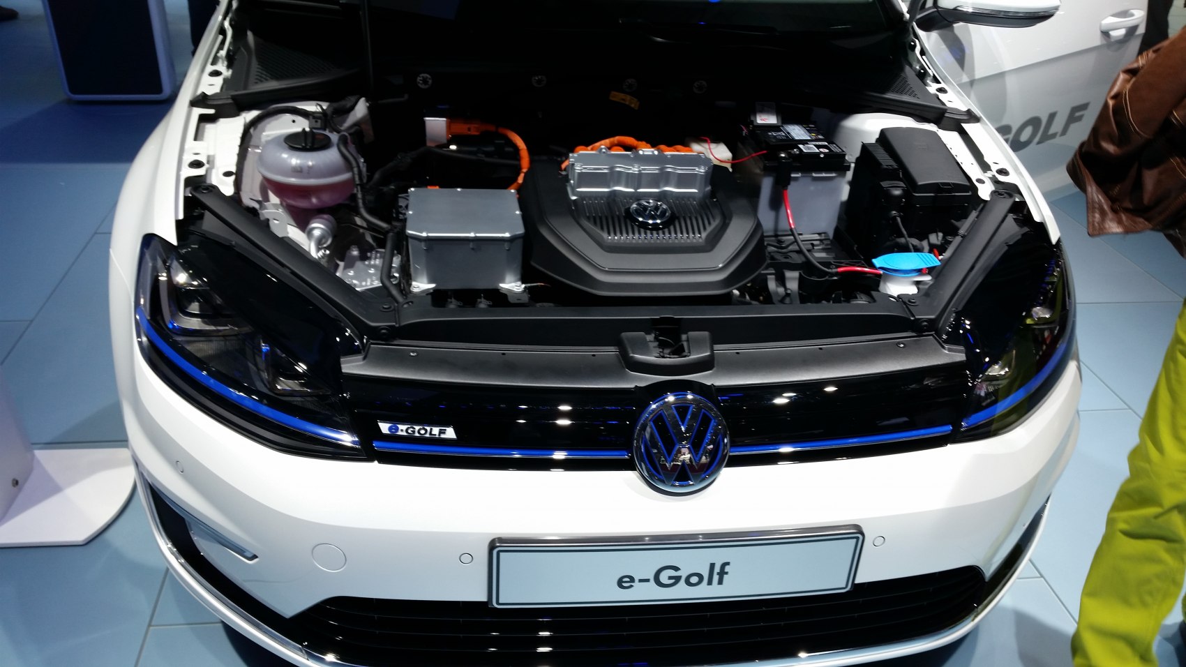 electric engine bay with VW emblem and EV components