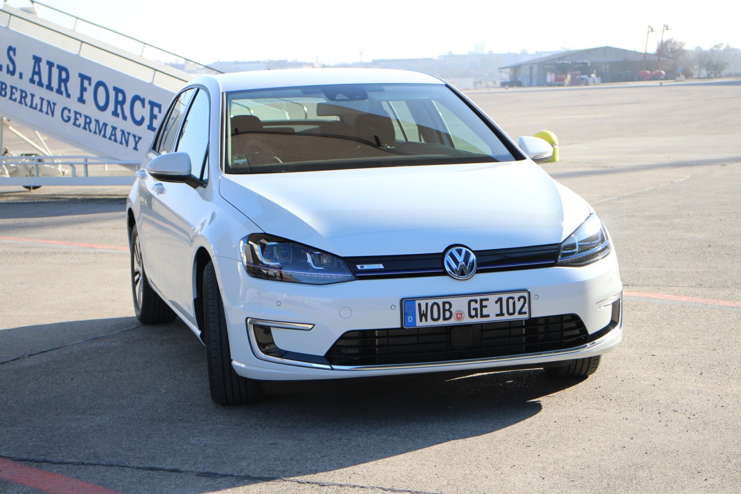 Front view of a 5-door vehicle with modern headlights and grille design
