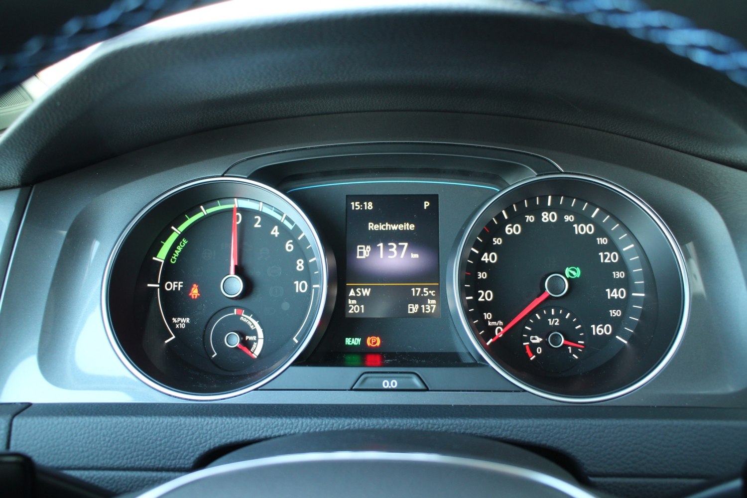 Instrument cluster with speedometer, power meter, and digital range display