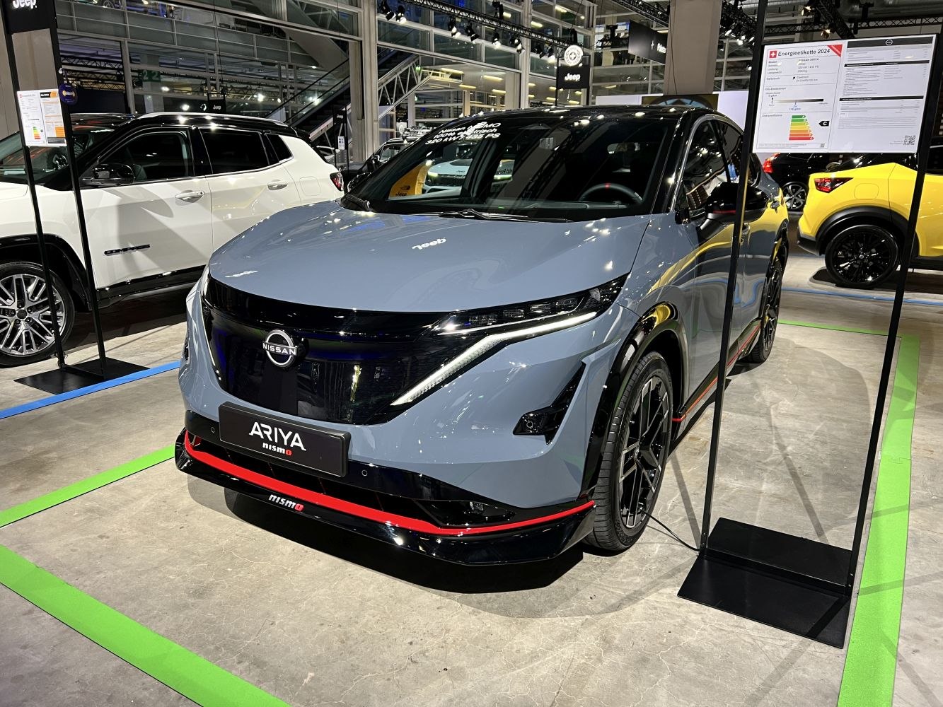 Front view of electric SUV with LED headlights and sporty front bumper