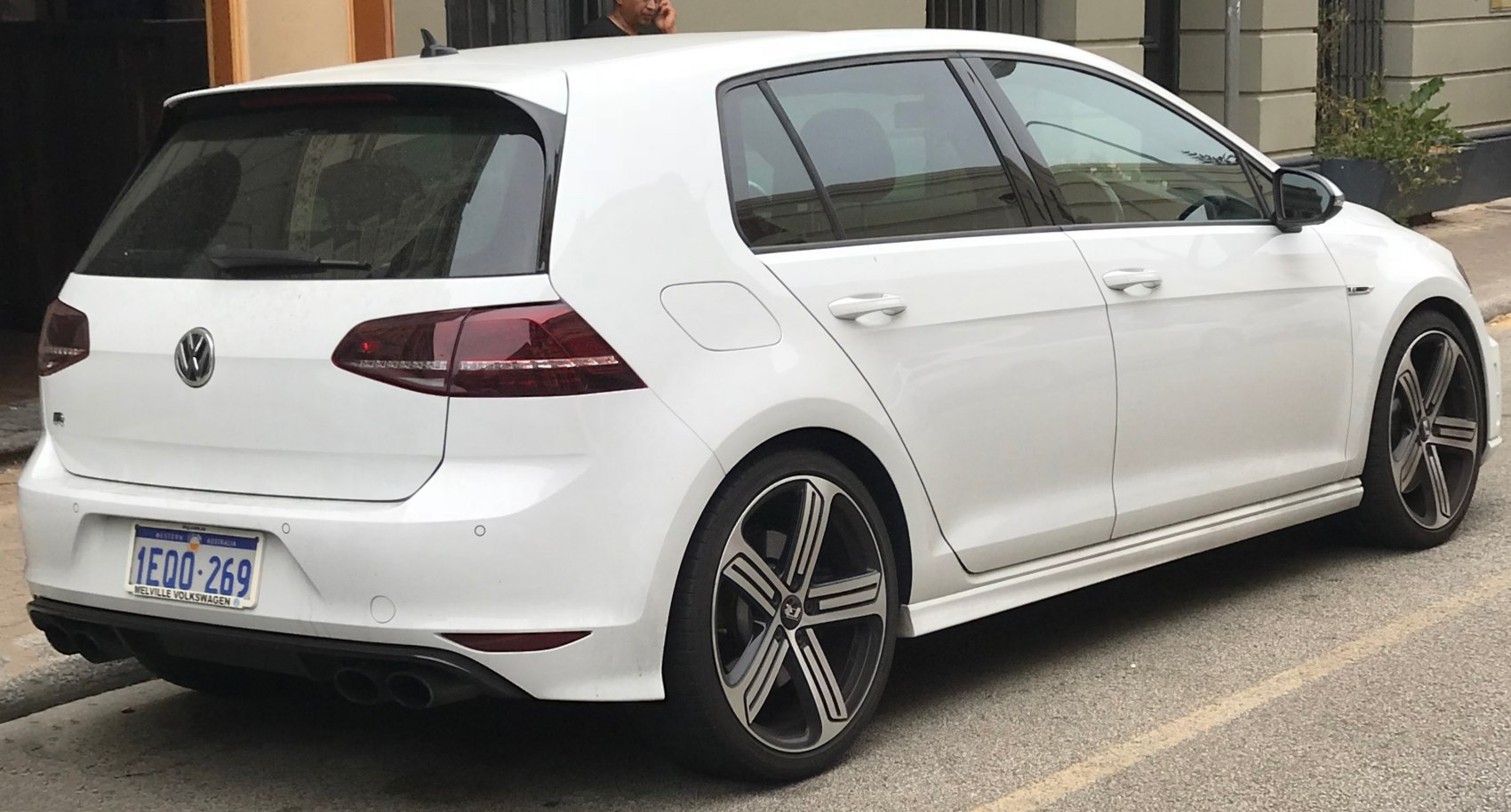 Rear side view with quad exhaust and alloy wheels