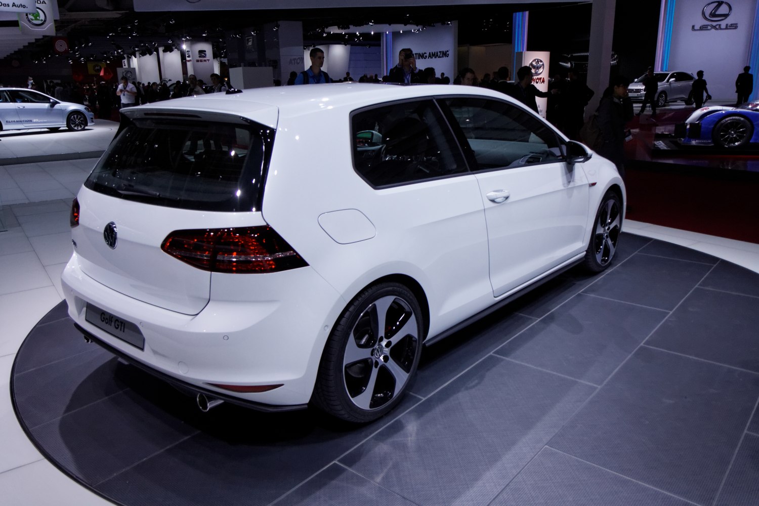 Rear angled view of 3-door hatchback with distinctive alloy wheels