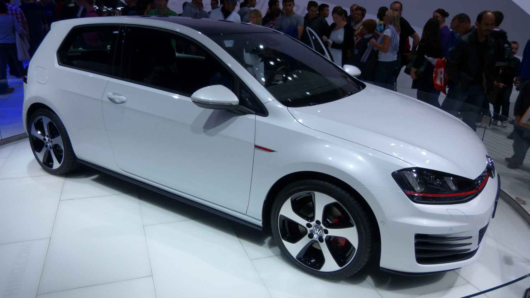 Side profile of a sporty 3-door hatchback with alloy wheels