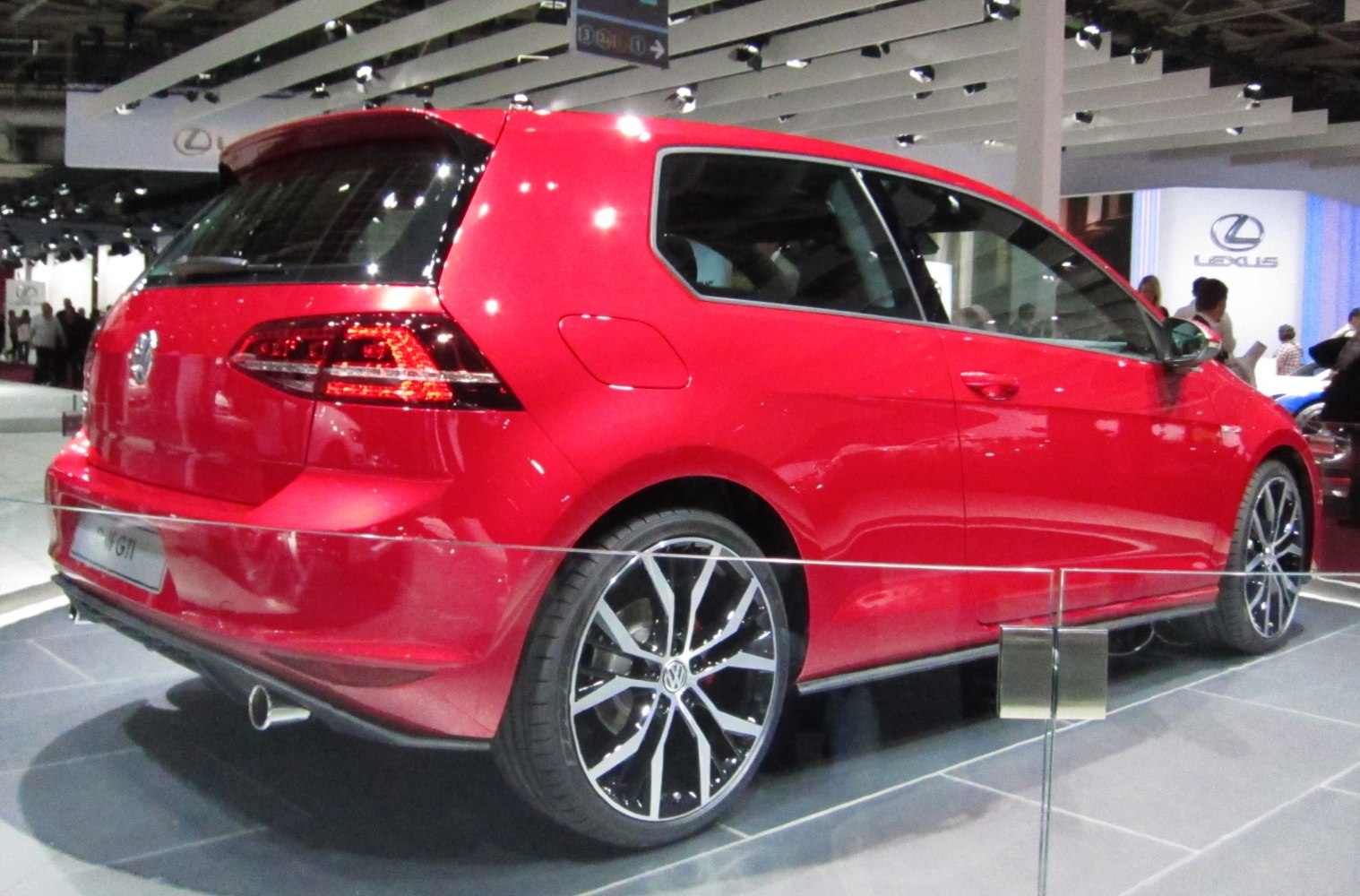 Red 3-door hatchback with alloy wheels and rear spoiler
