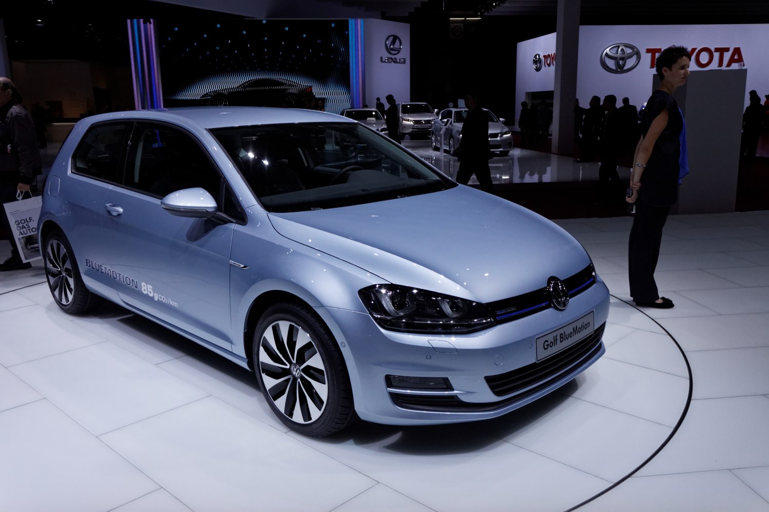 Light blue 3-door hatchback showing front and side view with distinctive wheels