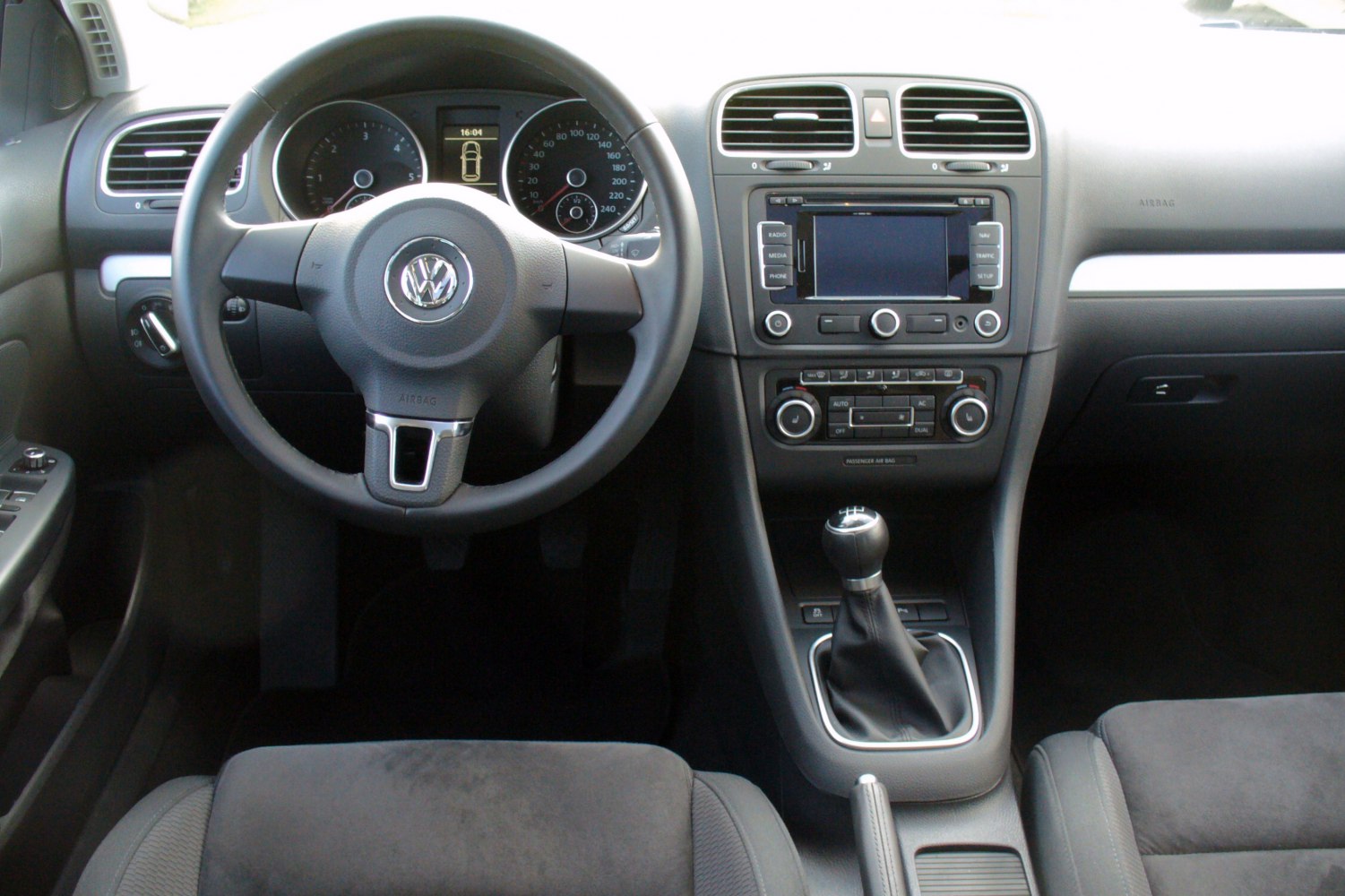 Dashboard and manual gear shift with multimedia system and air conditioning controls