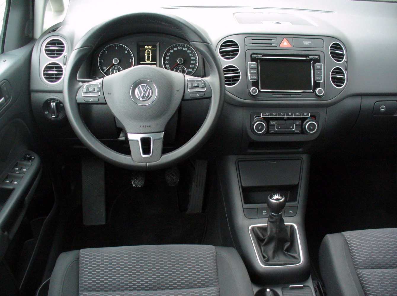 Interior dashboard, steering wheel, manual transmission gear stick