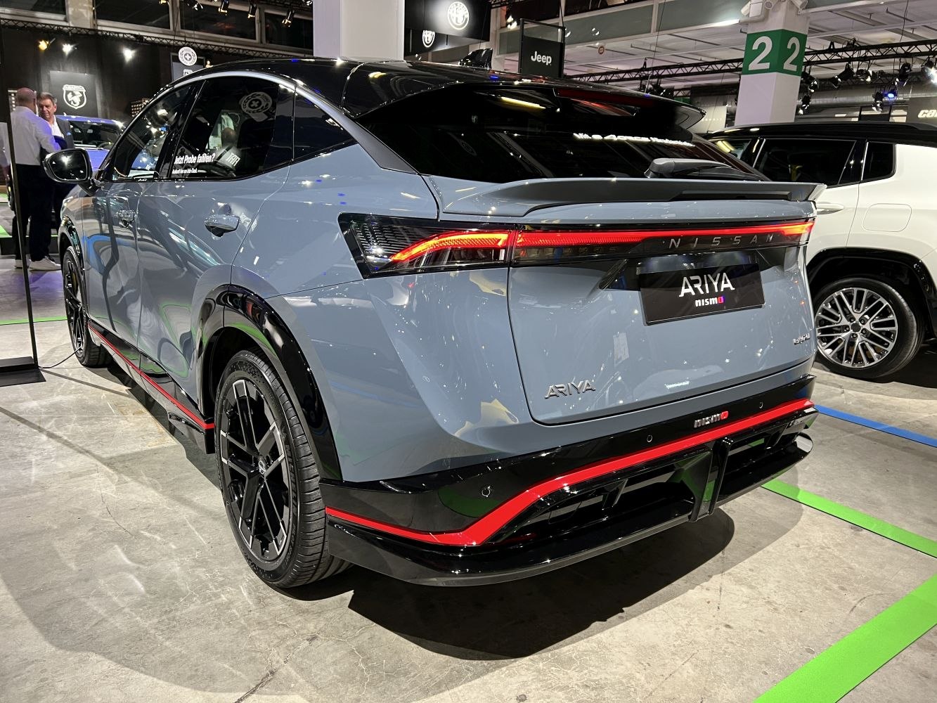 Rear view of a modern electric SUV with sleek LED tail lights and aerodynamic design.
