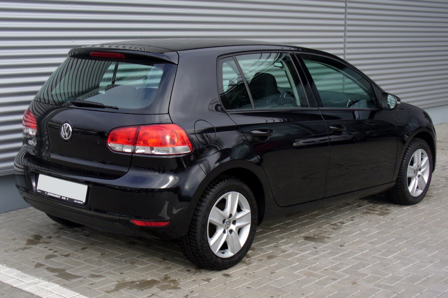 Black 5-door hatchback rear and side view with alloy wheels and taillights