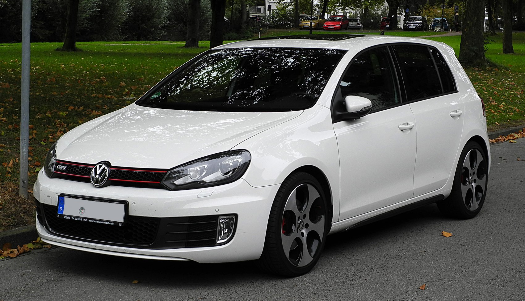White hatchback with sporty front grille and alloy wheels