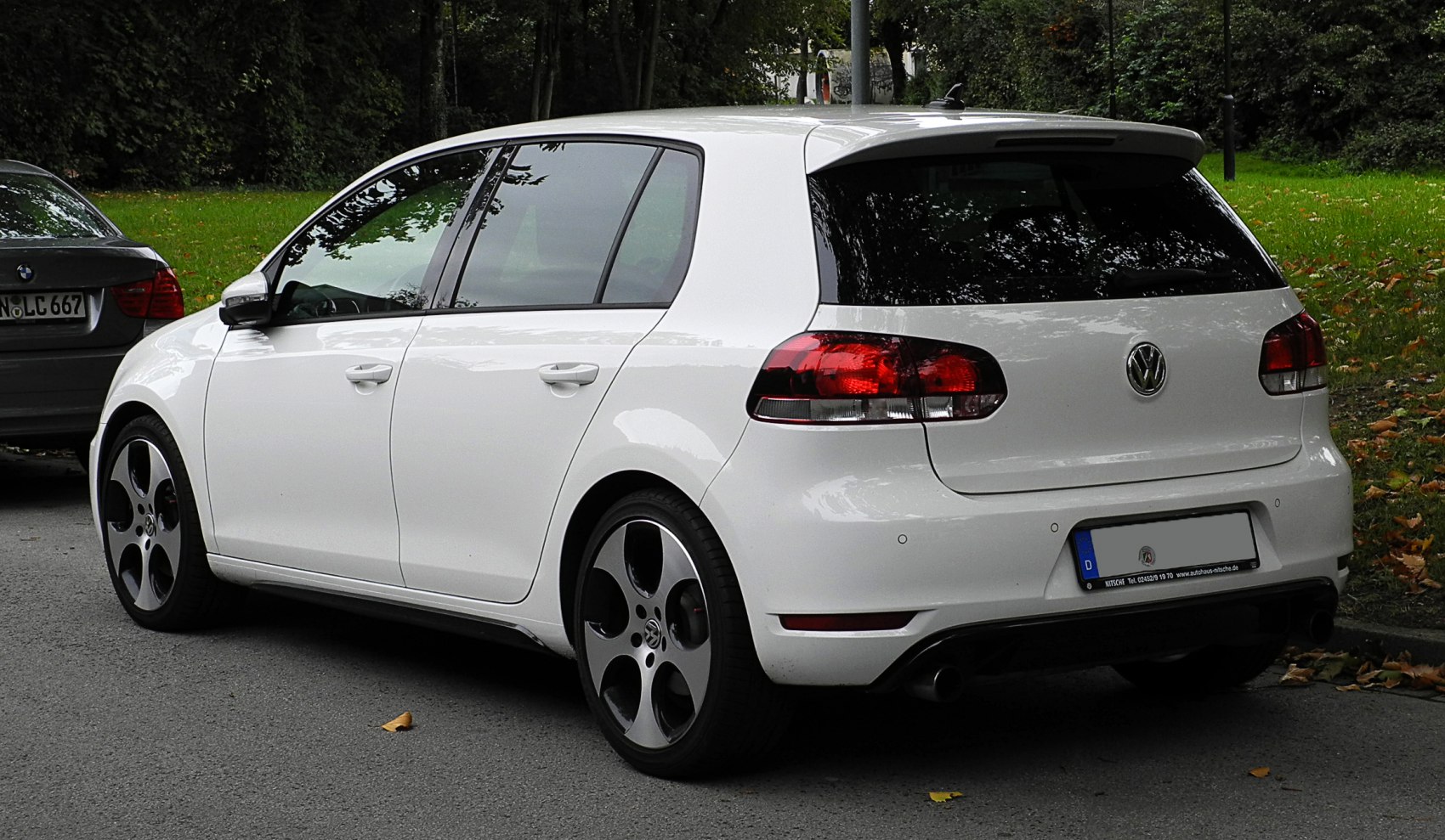 Rear and side view with distinctive alloy wheels and round tail lights