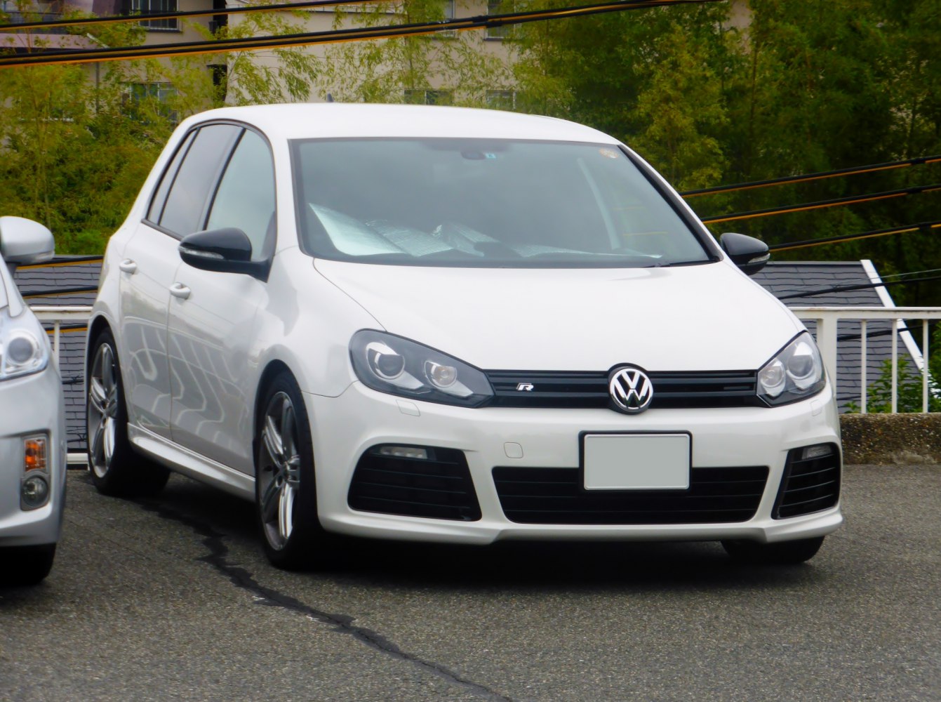 Front view with distinctive grille, headlights, and sporty bumper