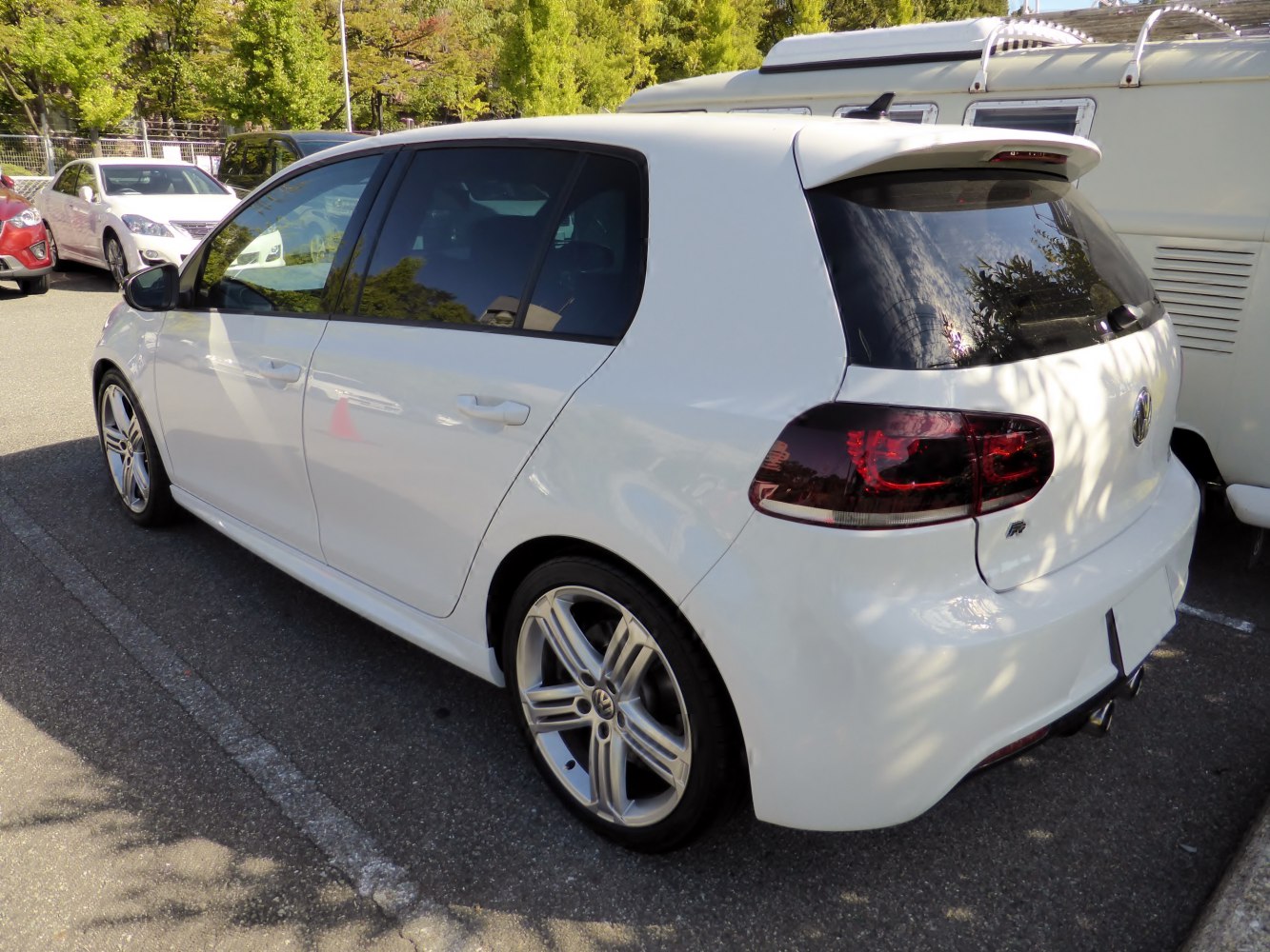 White 5-door hatchback with alloy wheels and rear spoiler