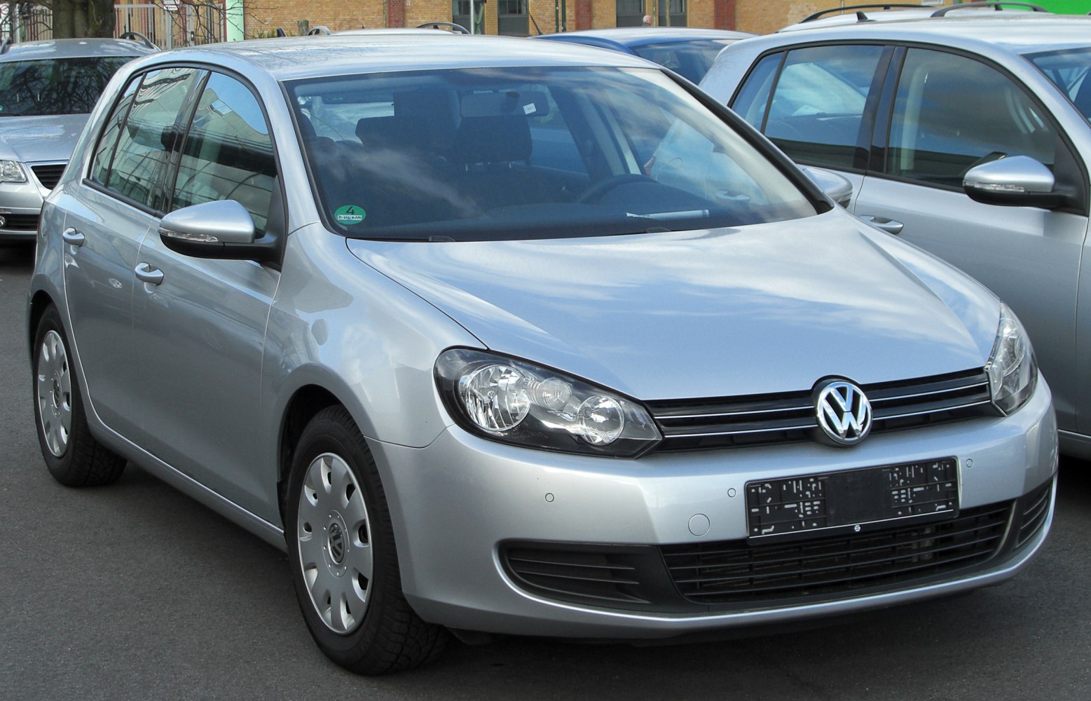 Front view of a 5-door hatchback with headlights and grille.