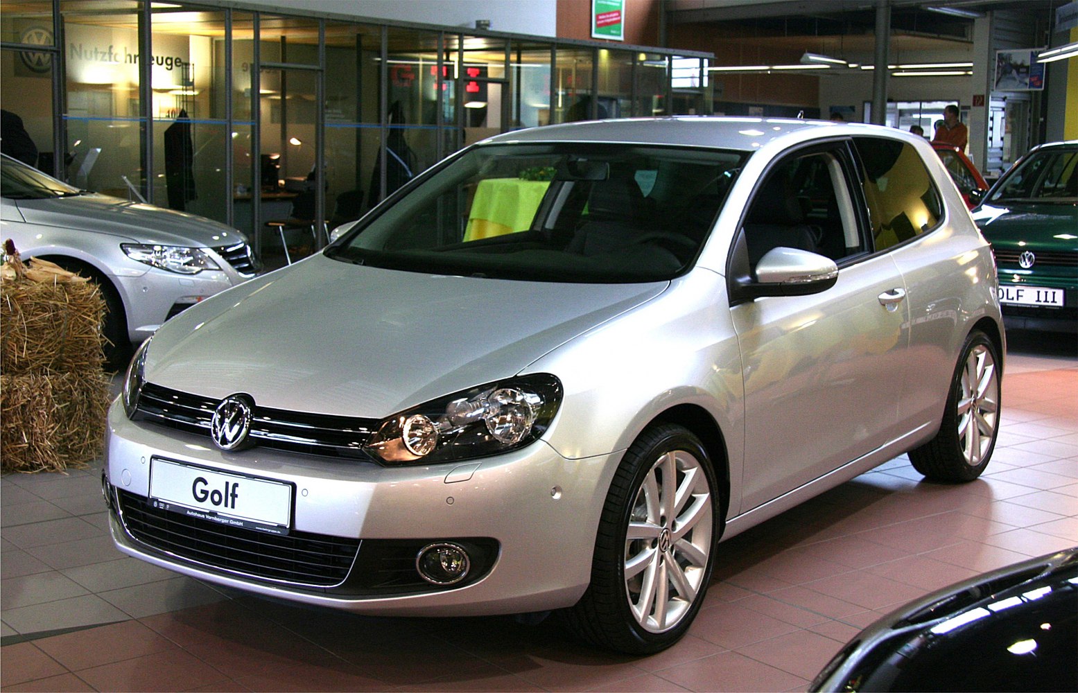 Silver 3-door hatchback with alloy wheels and headlamps