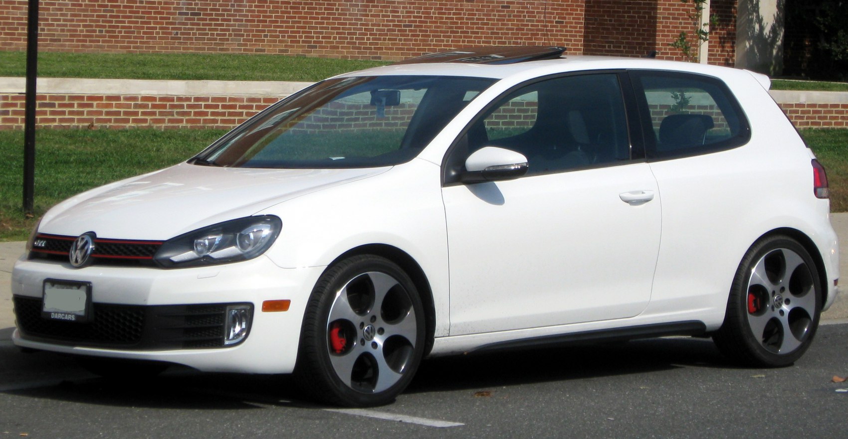White 3-door hatchback front-side angle with alloy wheels