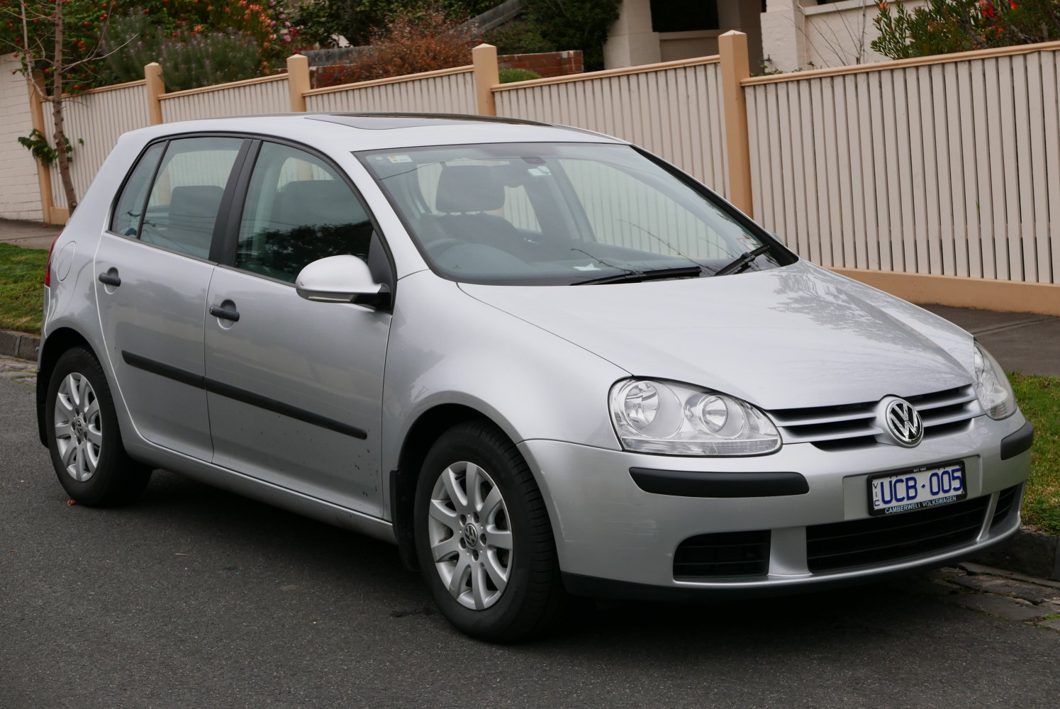 Silver 5-door compact hatchback with alloy wheels and prominent headlights