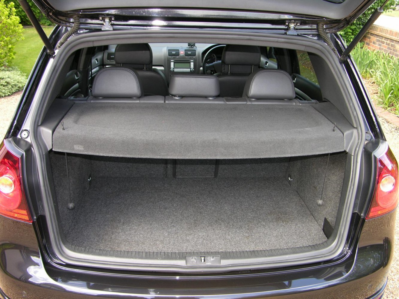 Open trunk with spacious cargo area and rear seats visible