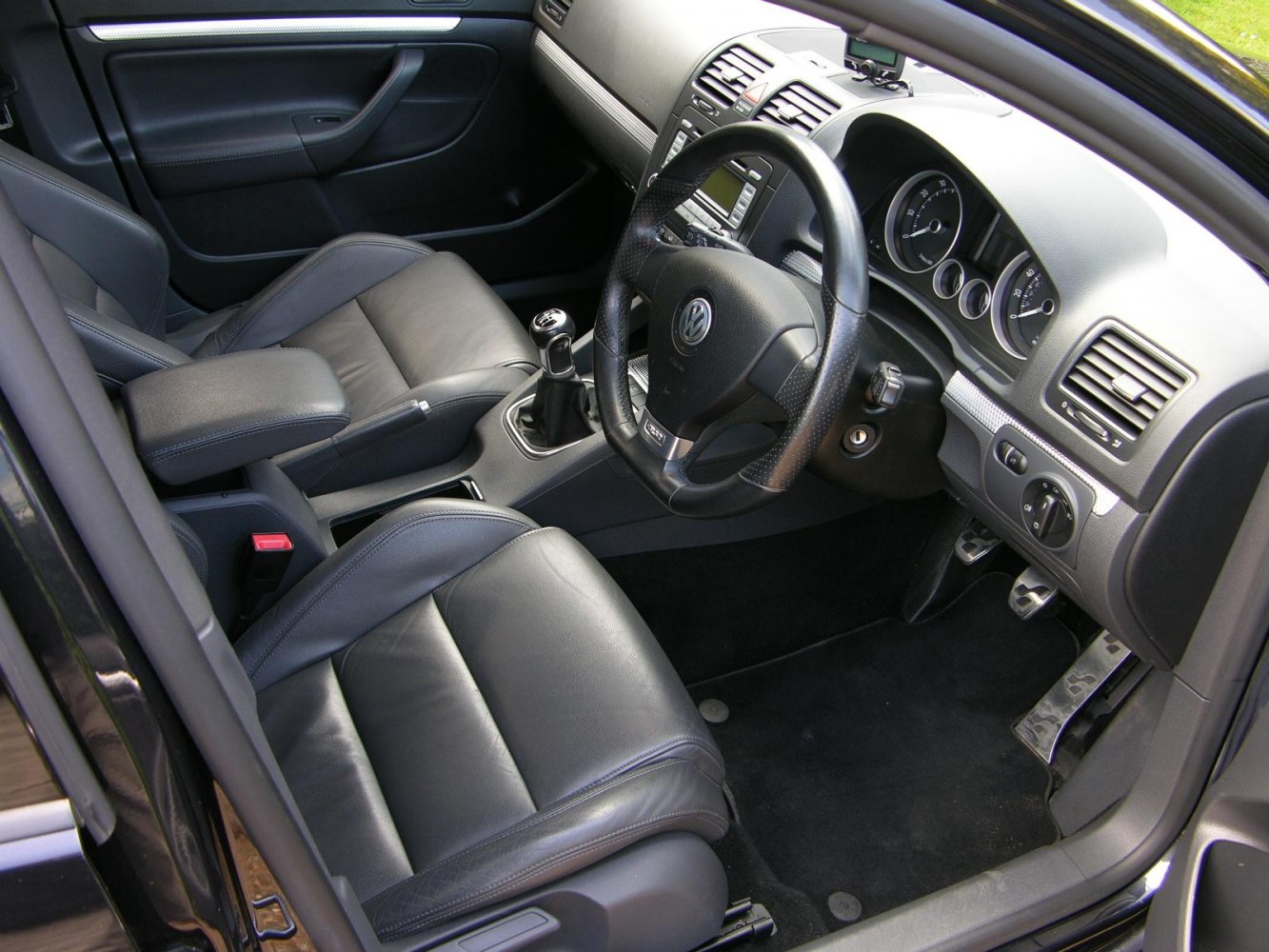 Modern car interior with manual gear shift and leather seats