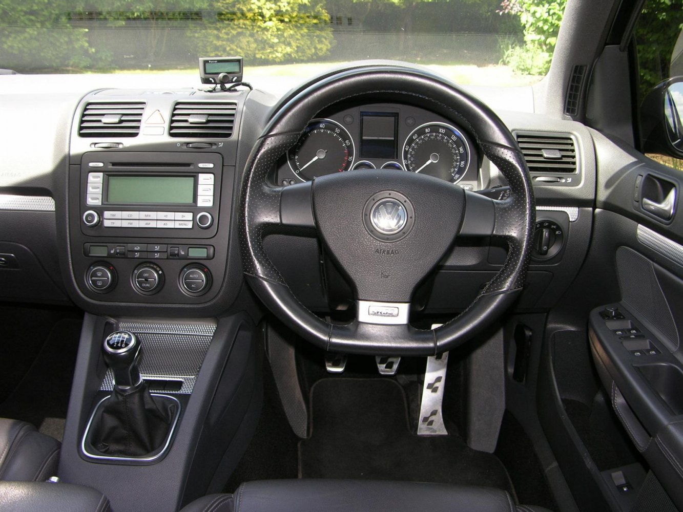 Manual gear stick and multifunction steering wheel with instrument cluster