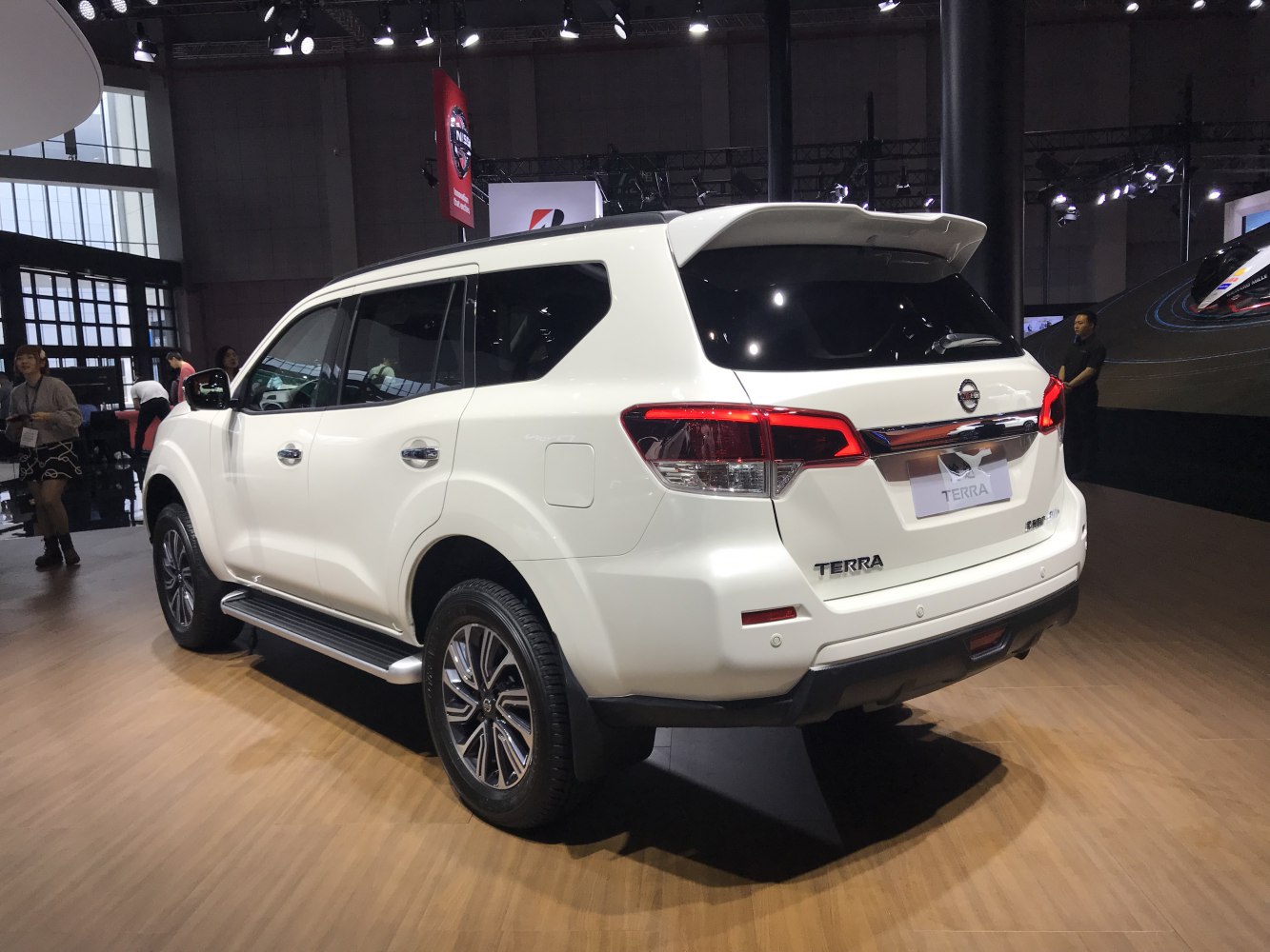 Rear side view of SUV with rear spoiler and alloy wheels