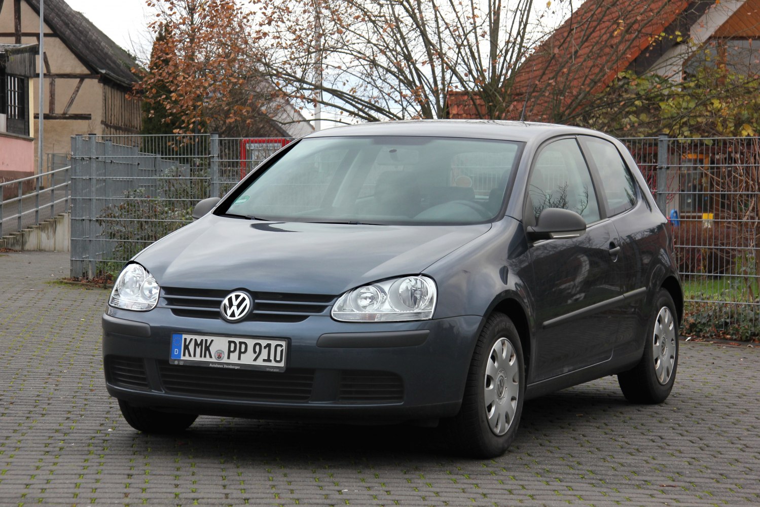 Front view with headlights and bumper of a 3-door compact hatchback
