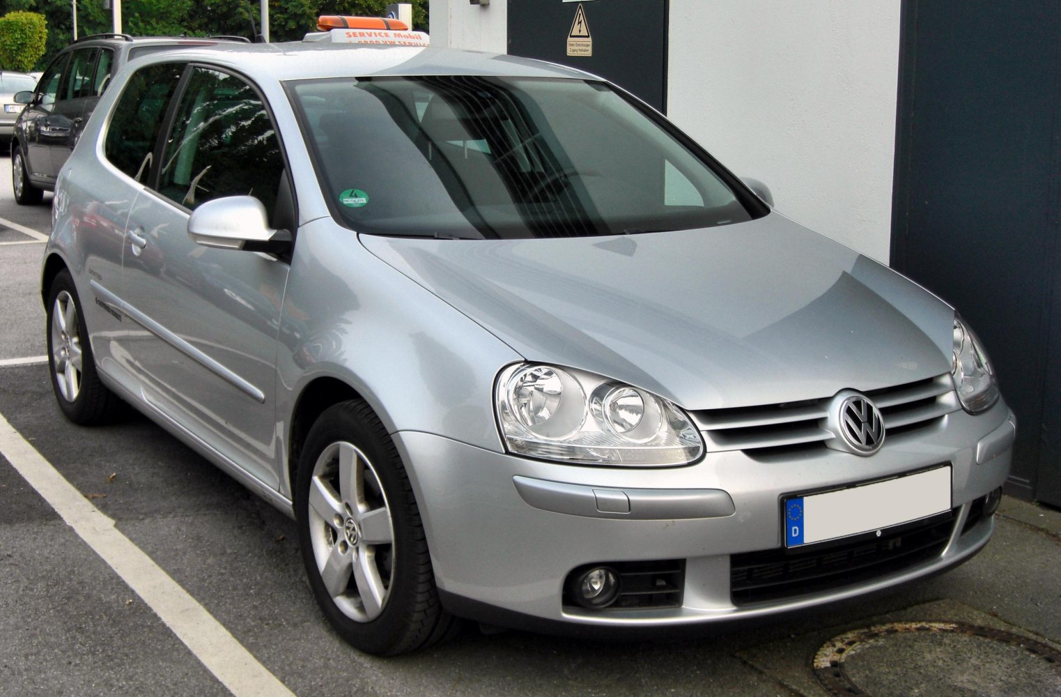 Silver 3-door hatchback with headlights and alloy wheels