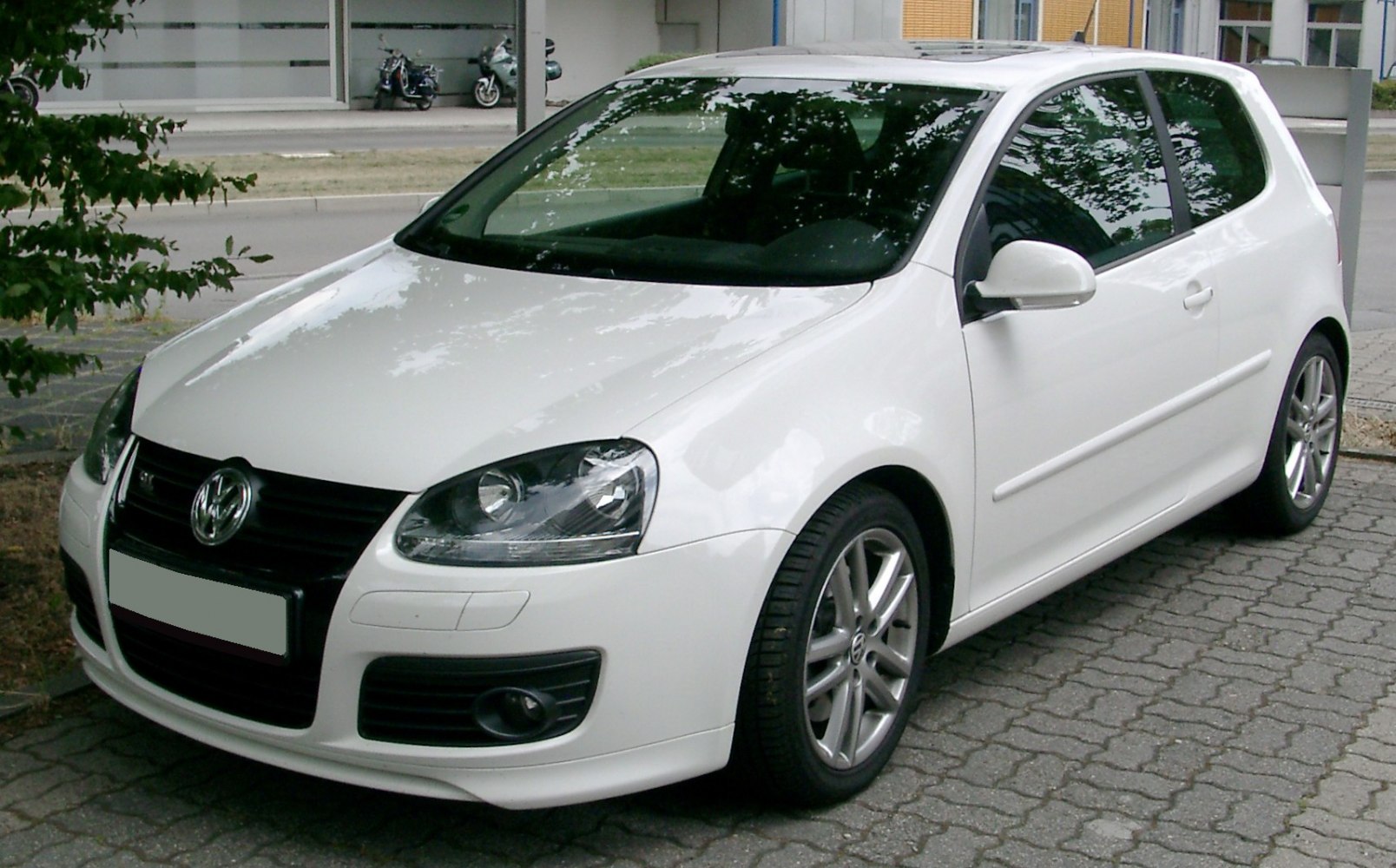 Front and side view of 3-door hatchback with alloy wheels and distinct headlights