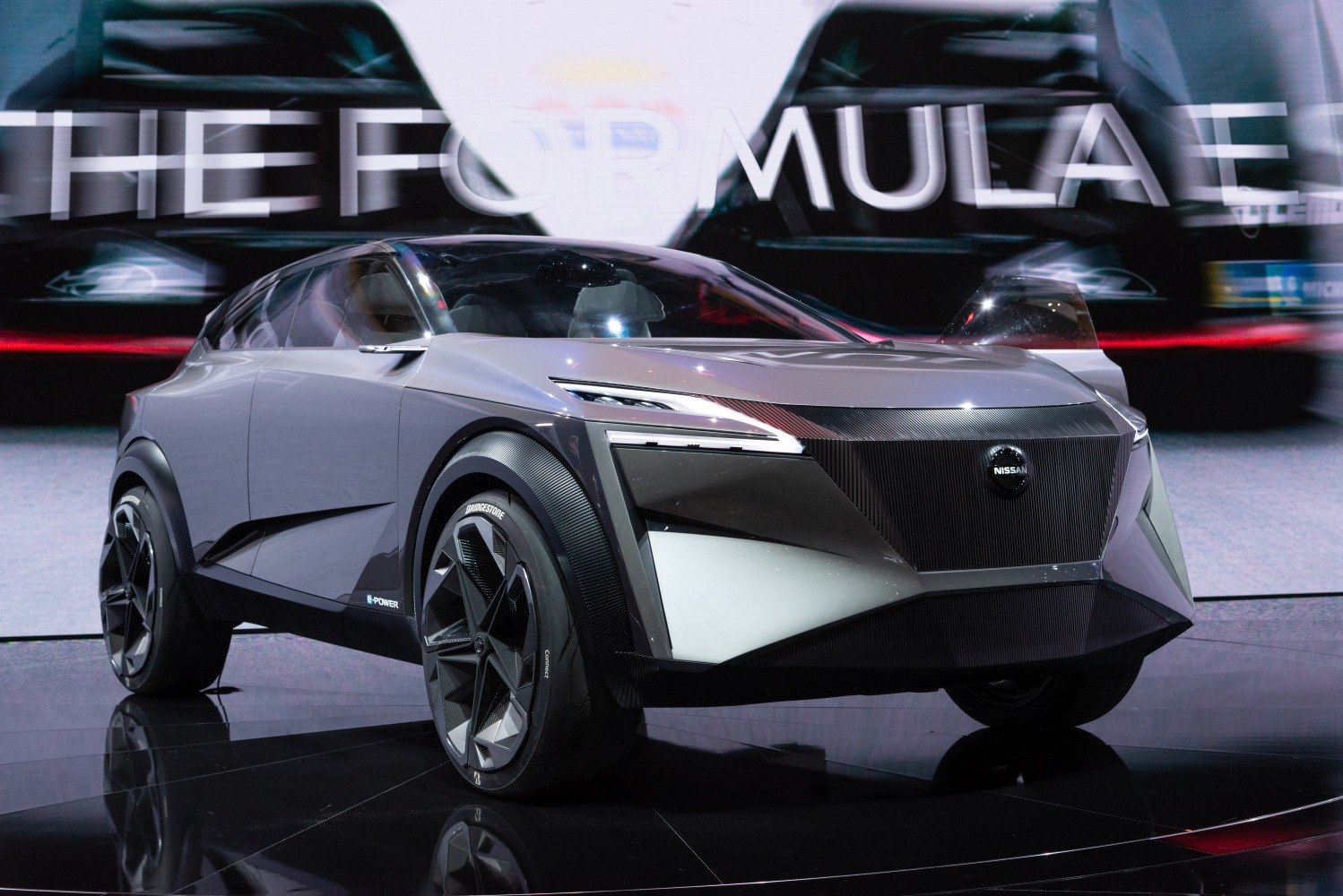 Sharp angular front end and sleek LED headlights of futuristic SUV concept.
