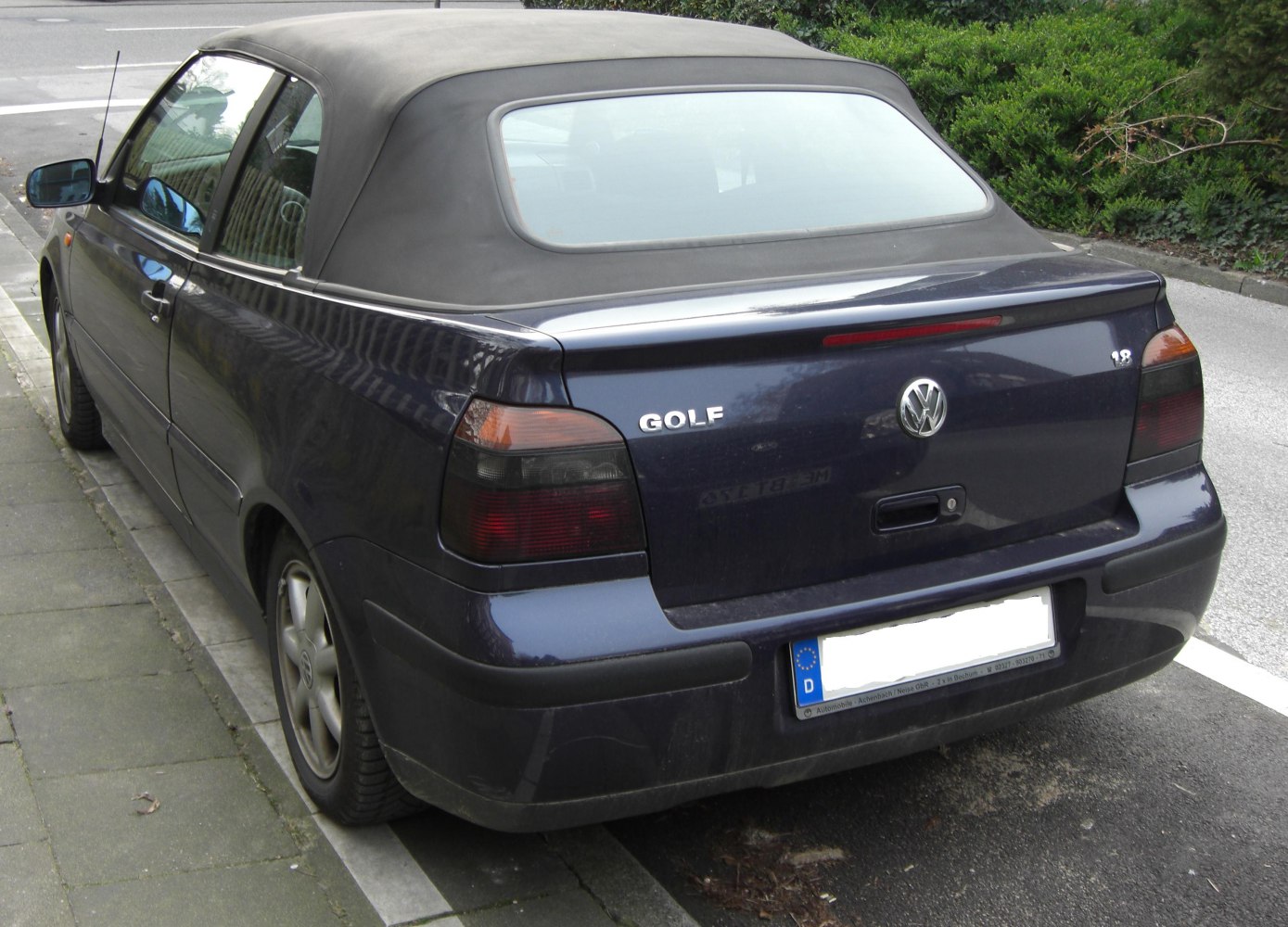 Rear view of a convertible with soft top roof and taillights