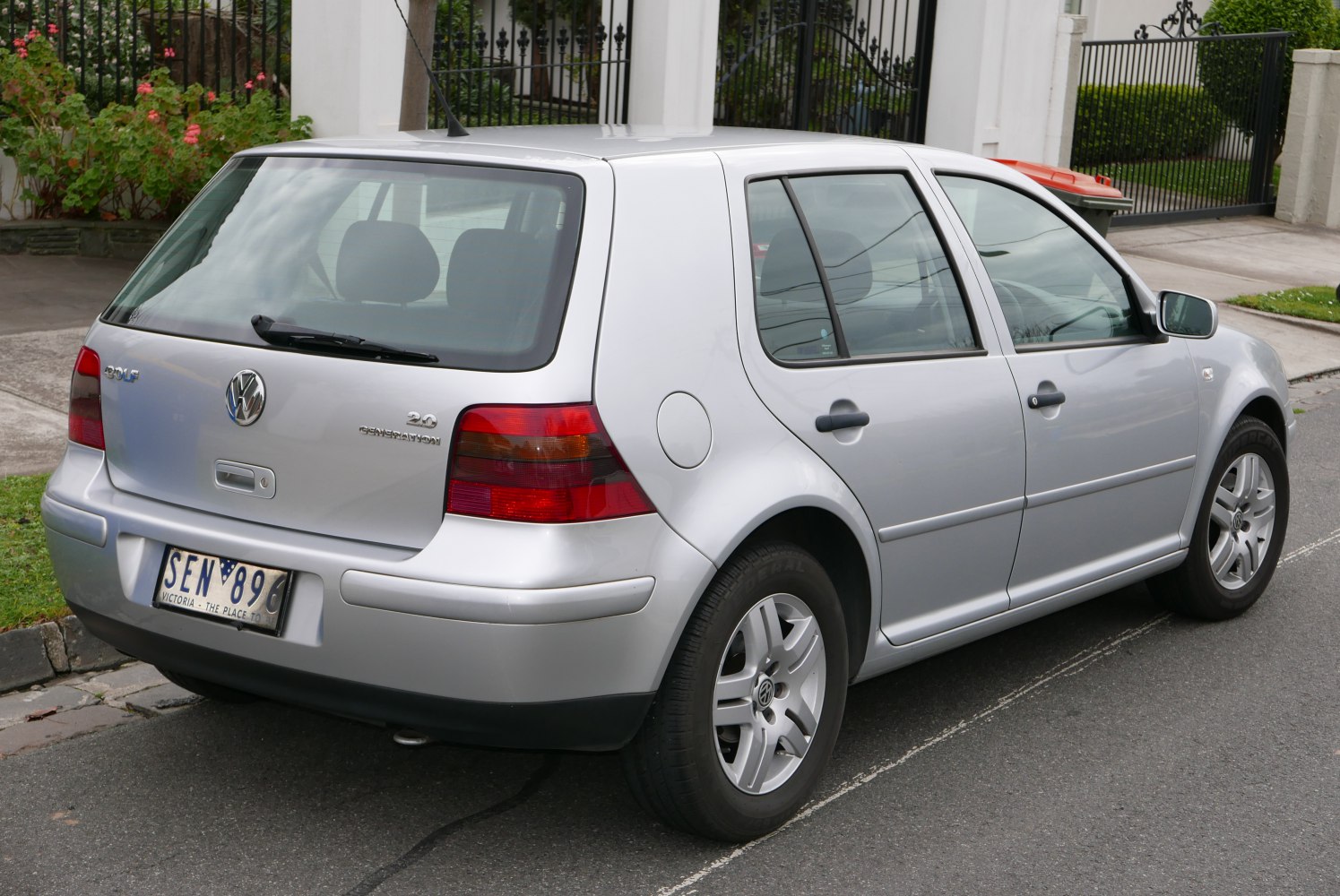 Silver Volkswagen hatchback rear side view with distinct tail lights