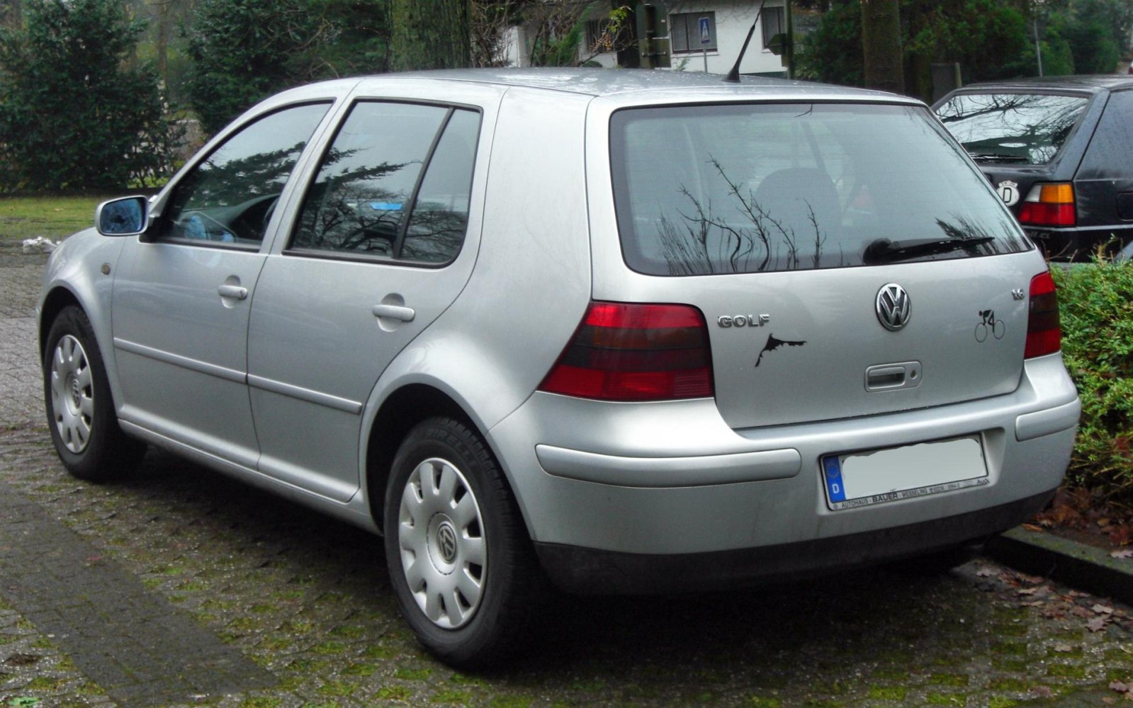 Rear and side view of compact hatchback with distinctive taillights.