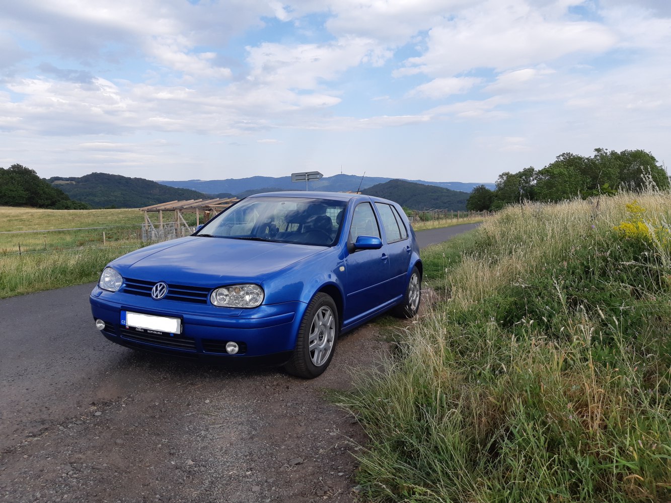Front view of compact hatchback showing headlights and grille.