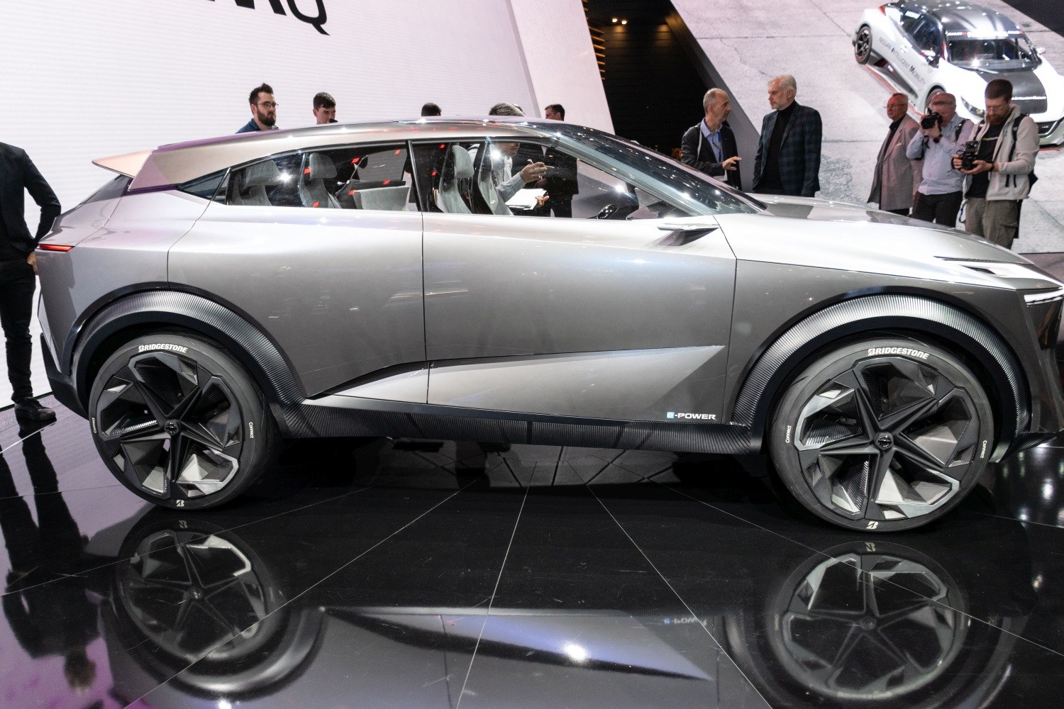 Side view of futuristic SUV with unique angular wheels and sleek aerodynamic body