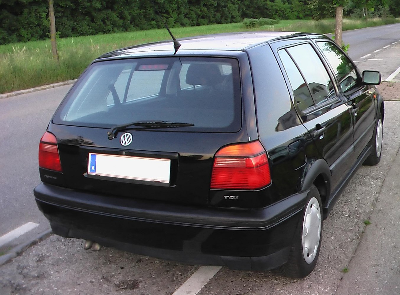 Rear view of a black hatchback with TDI badge and rear wiper