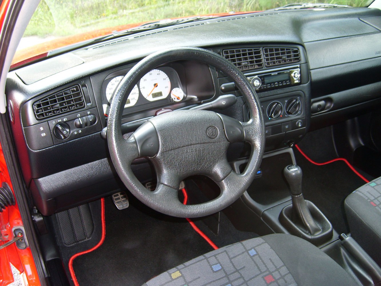 Dashboard and steering wheel with manual transmission gear stick