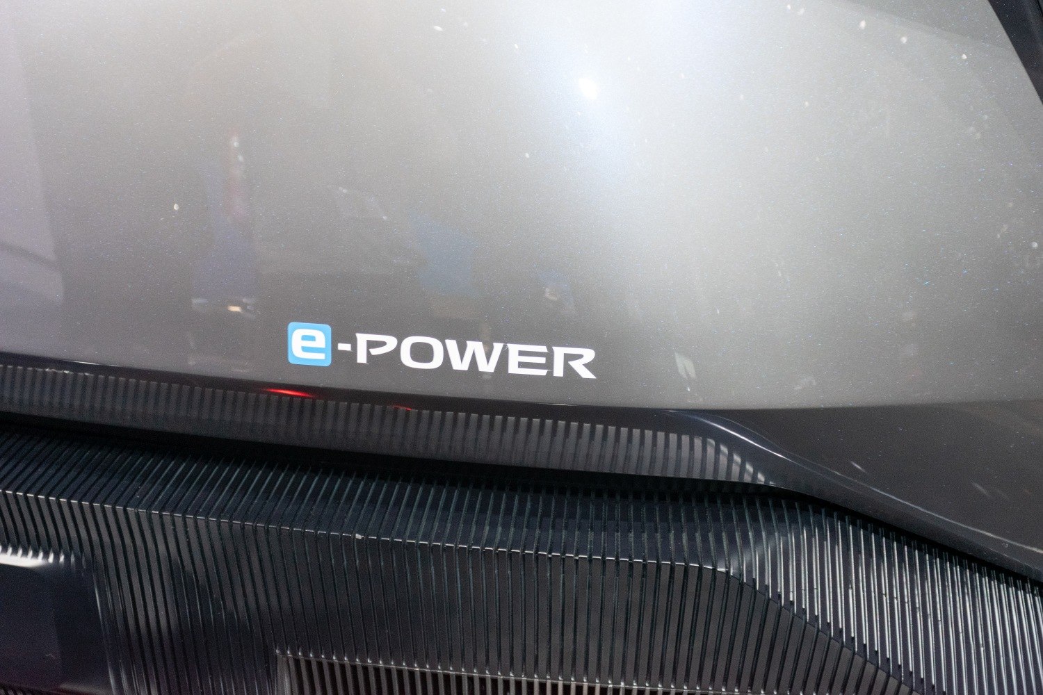 Close-up of e-POWER badge on car rear with textured design