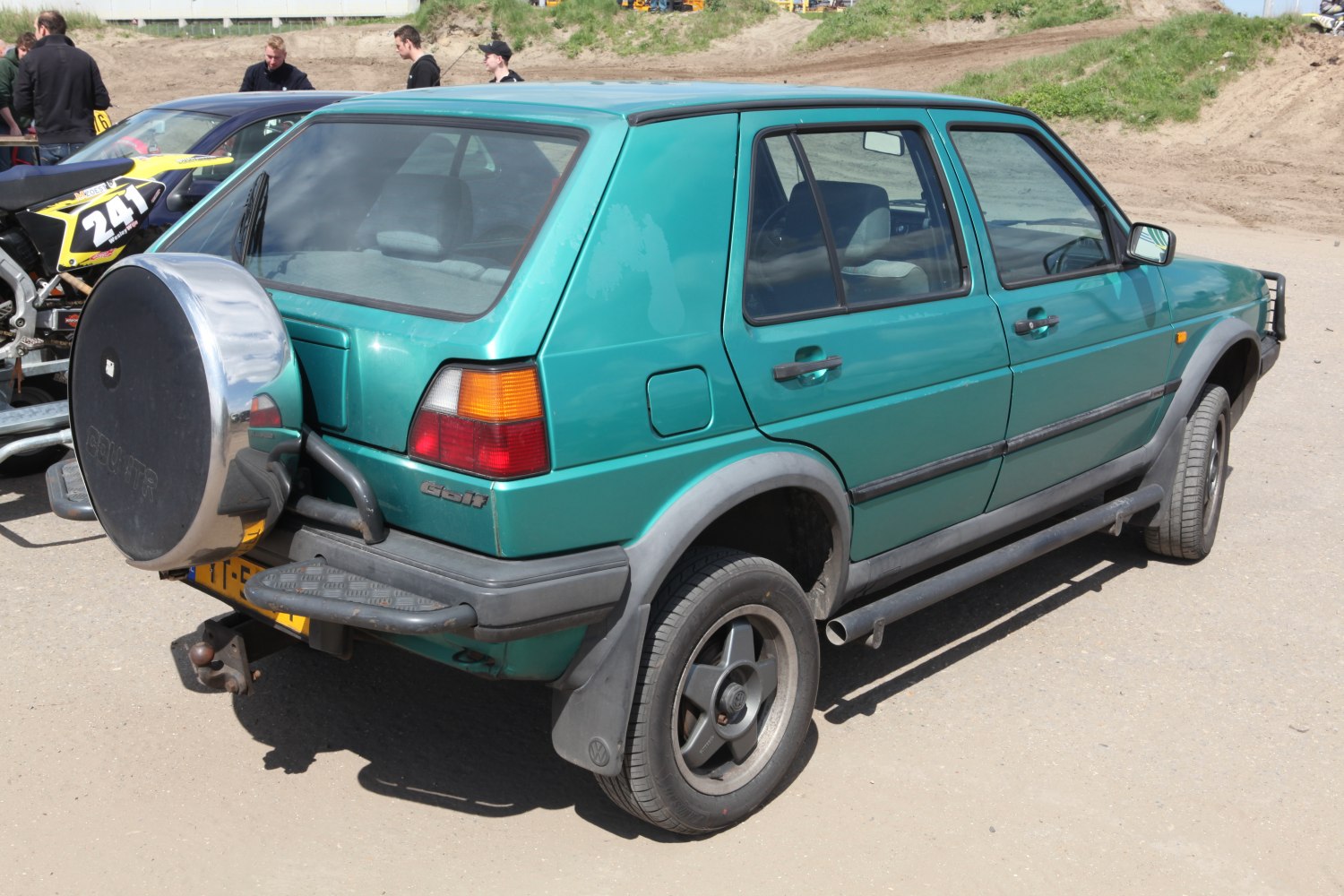 Rear-side view with spare tire mount and side steps