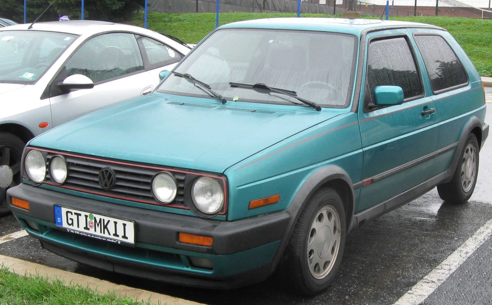 Front view with dual round headlights and black grille