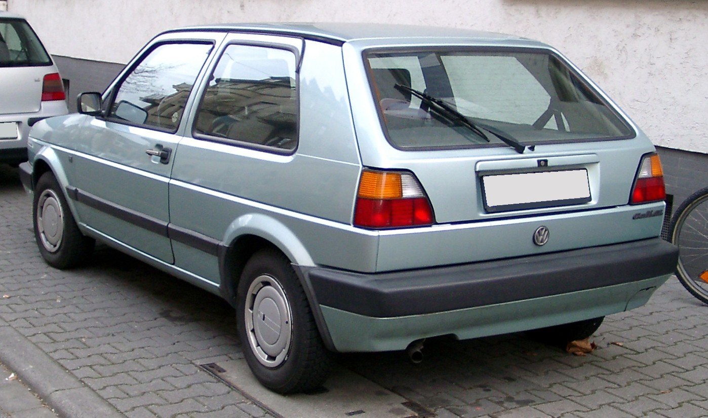 Rear-side hatchback view with distinctive taillights and bumper.