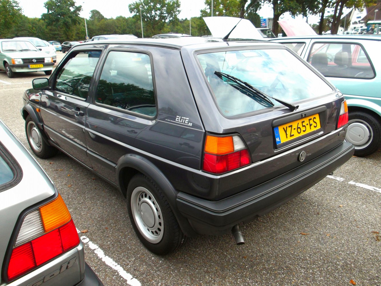 Rear side and taillights of a classic 3-door hatchback.