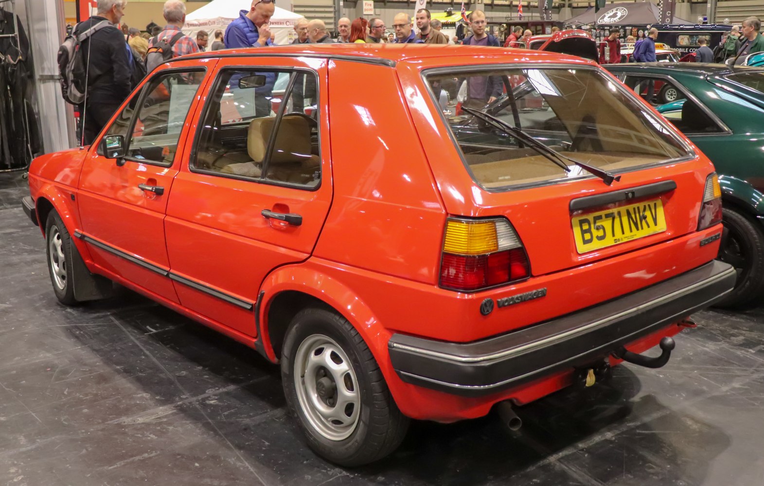 Rear side view of a 1980s five-door hatchback with angular lines and alloy wheels