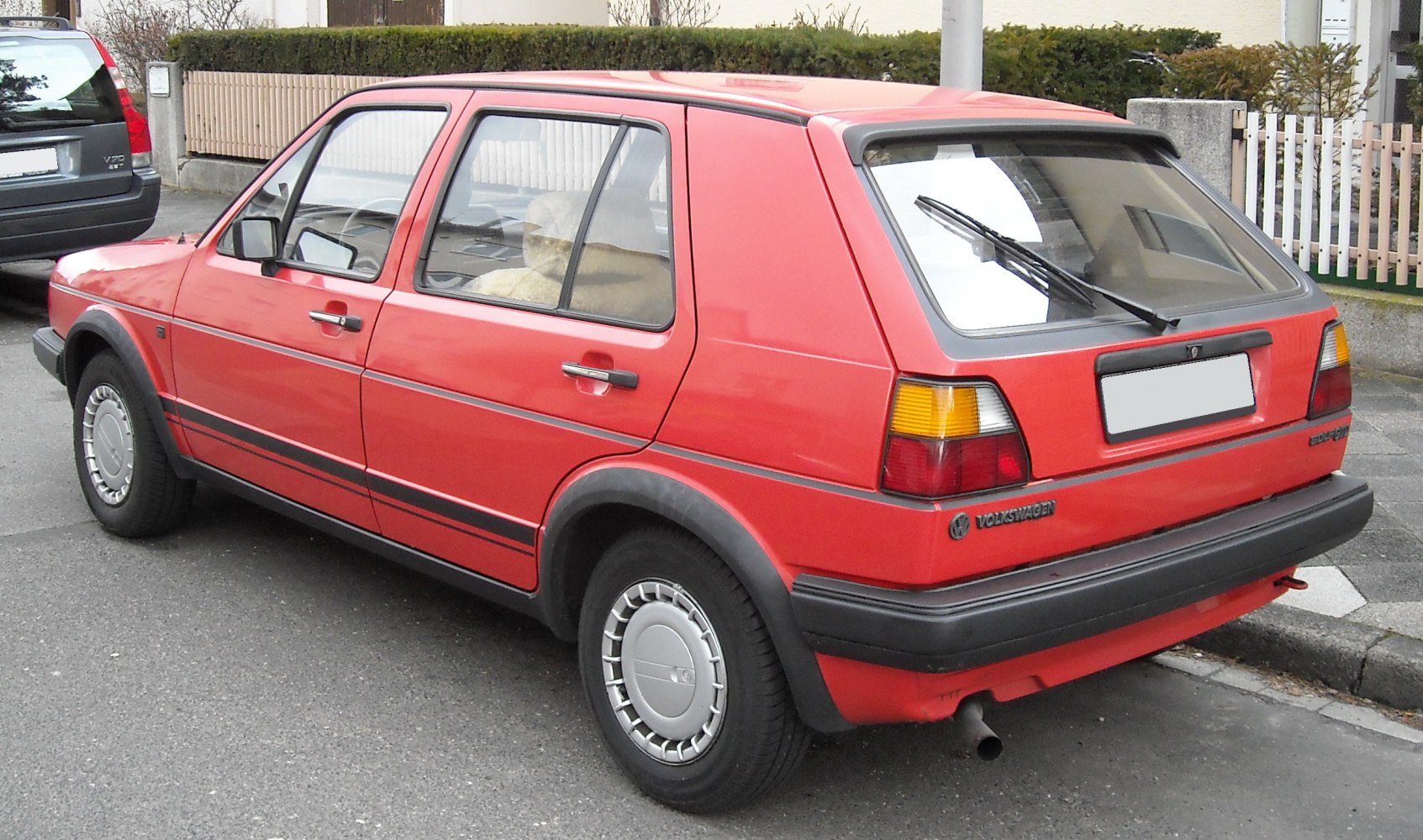 Rear and side view of 1980s 5-door hatchback with classic styling.