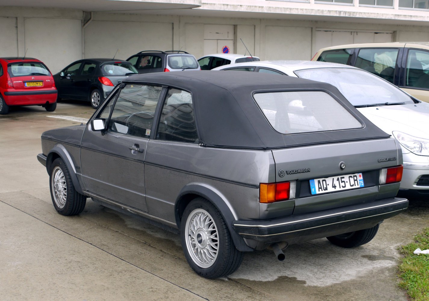 Rear view of classic convertible with soft top roof and alloy wheels