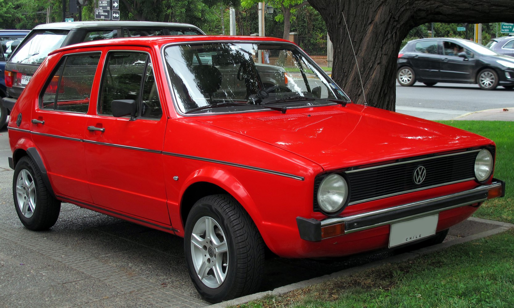 Red 5-door hatchback with round headlights and classic 1970s design