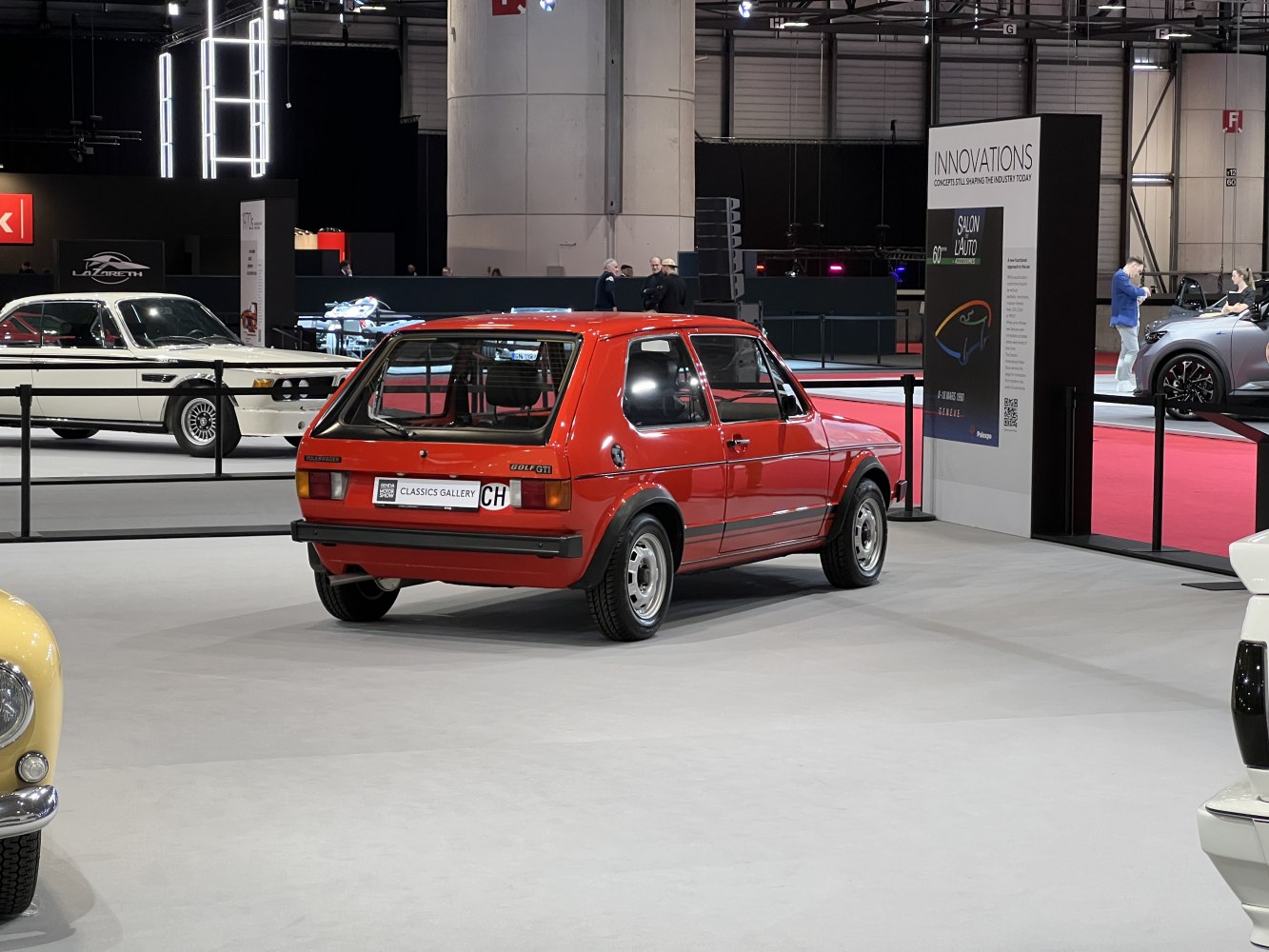 Rear view of a classic 3-door hatchback with compact shape and vintage design.