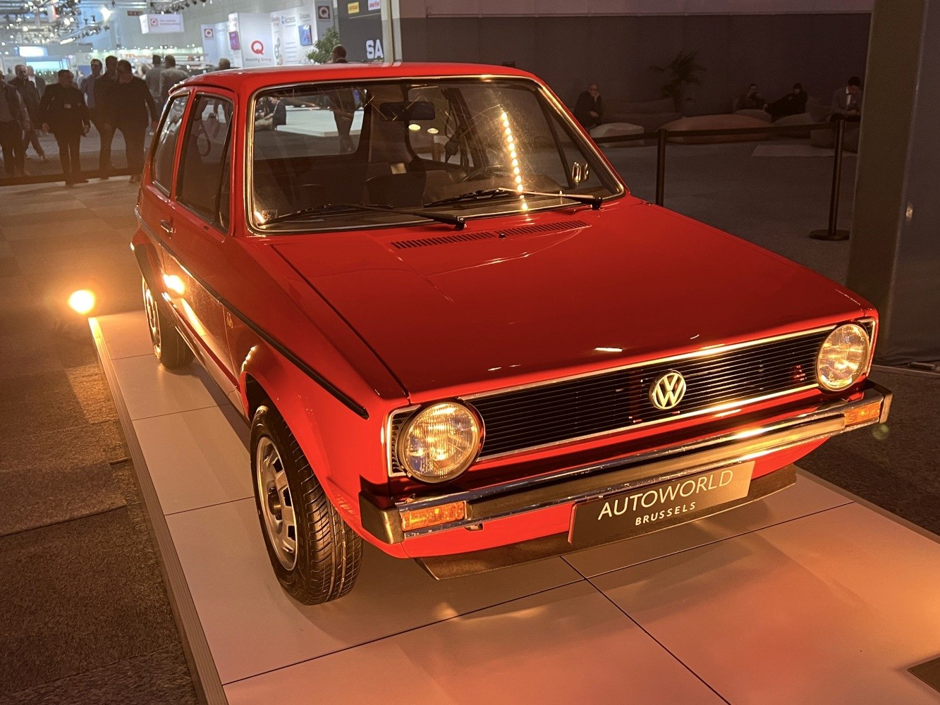 3-door compact hatchback with round headlights and black horizontal grille