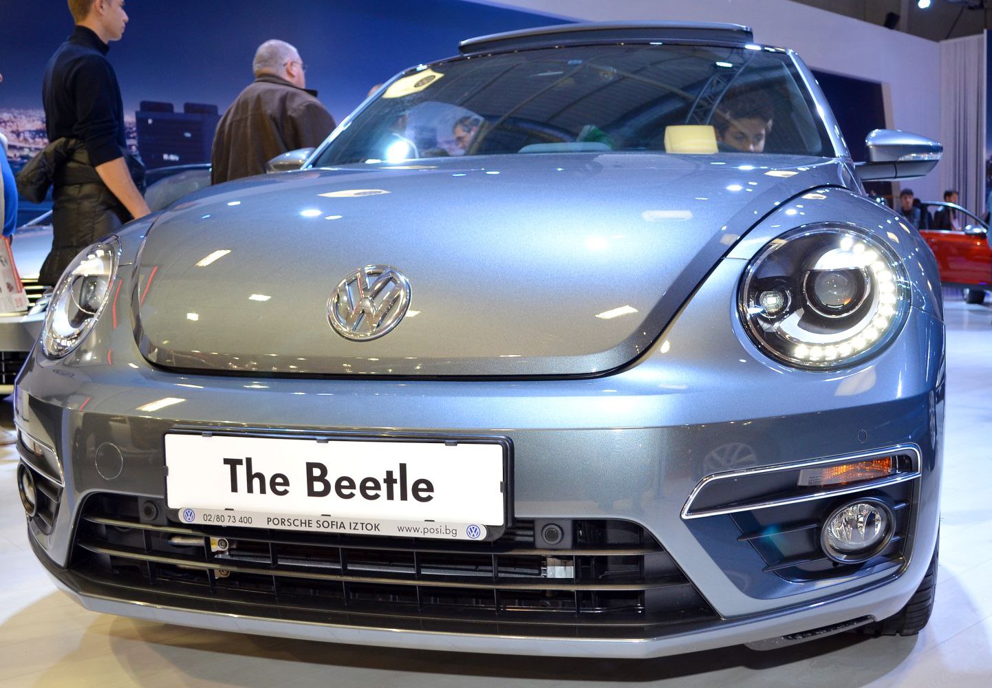 LED ring headlights and sleek front grill close-up on a compact car front.