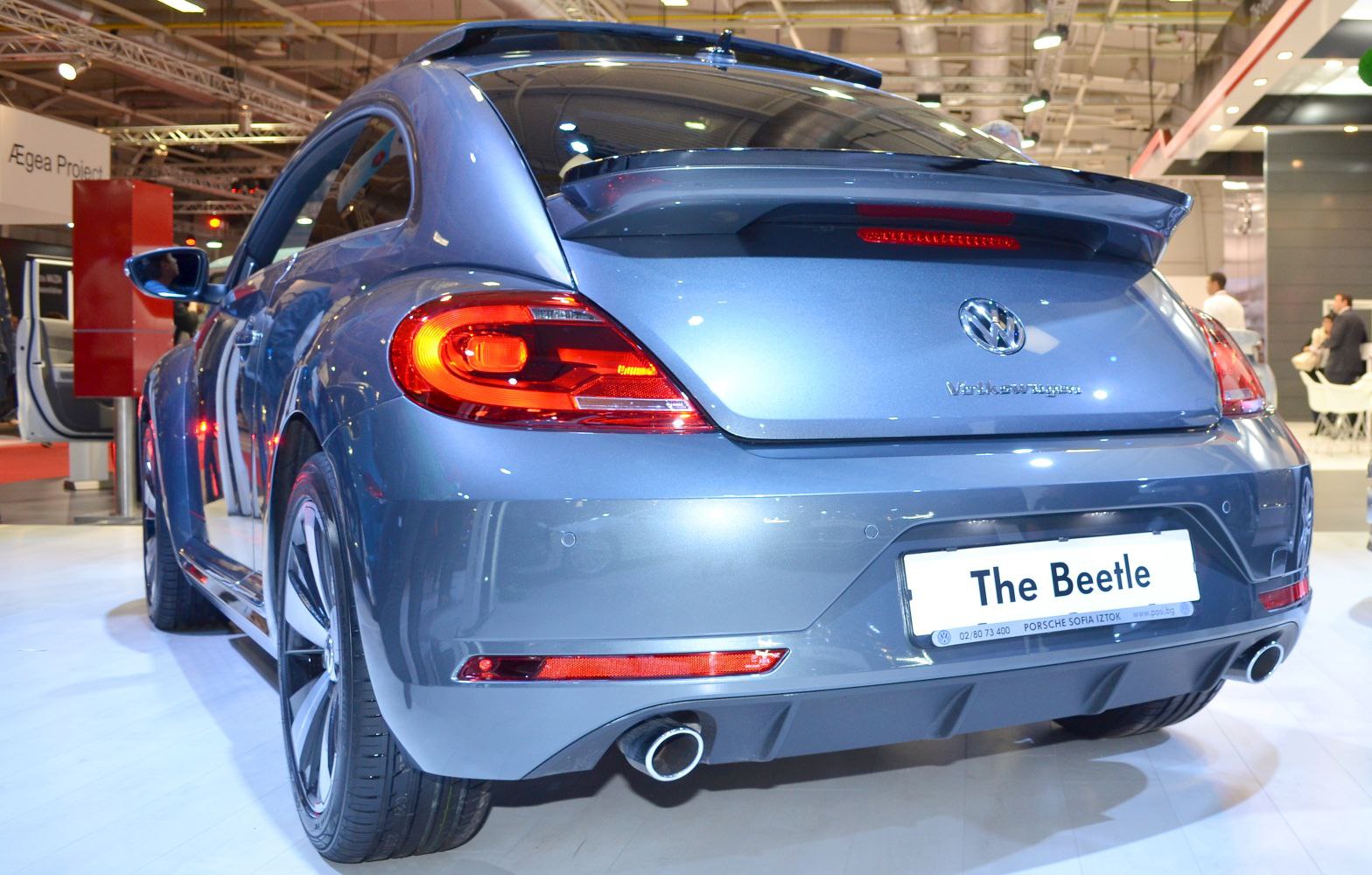 Rear view with dual exhaust, rear spoiler, and LED tail lights